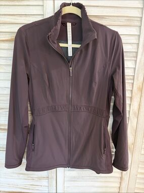 Lululemon Lightweight Full-Zip Jacket in a warm brown color.